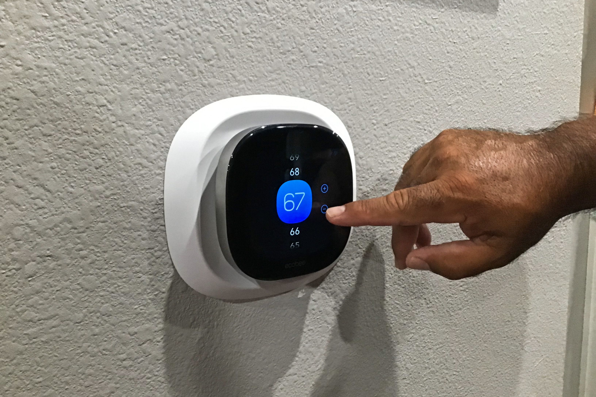 Smart thermostat displaying temperature controls and energy usage data