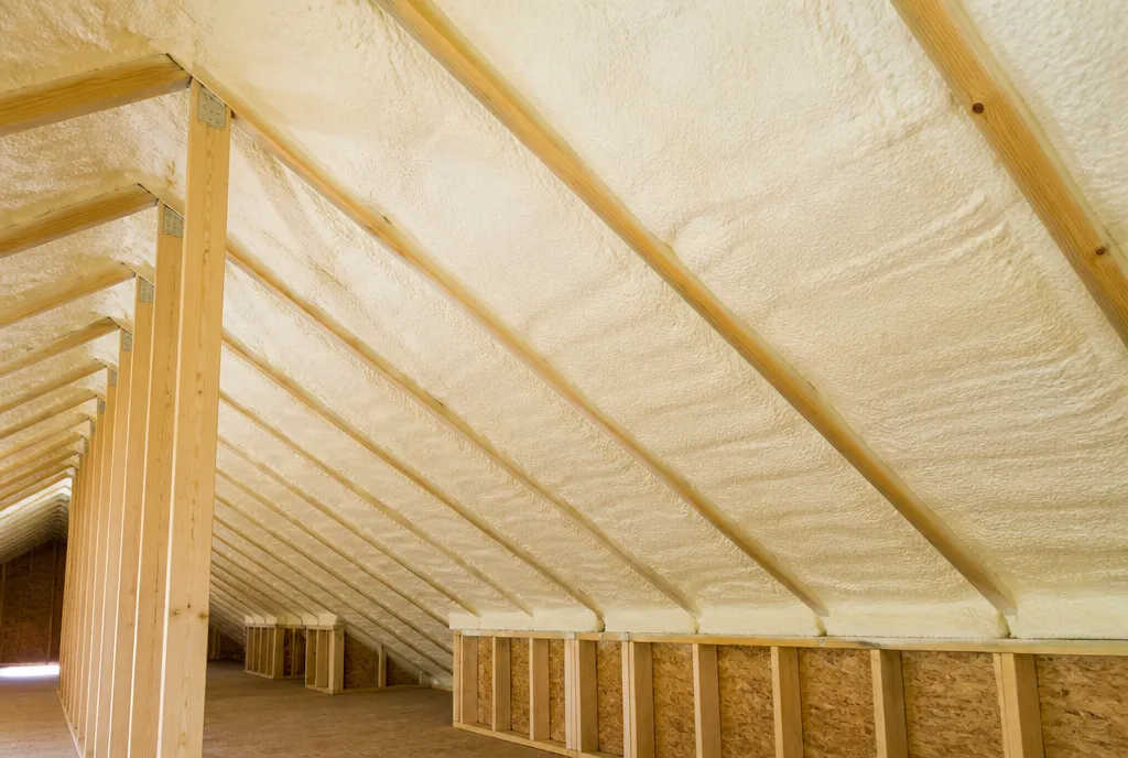 Closed-cell spray foam insulation applied to the underside of the roof deck in a sealed, unvented South Florida attic