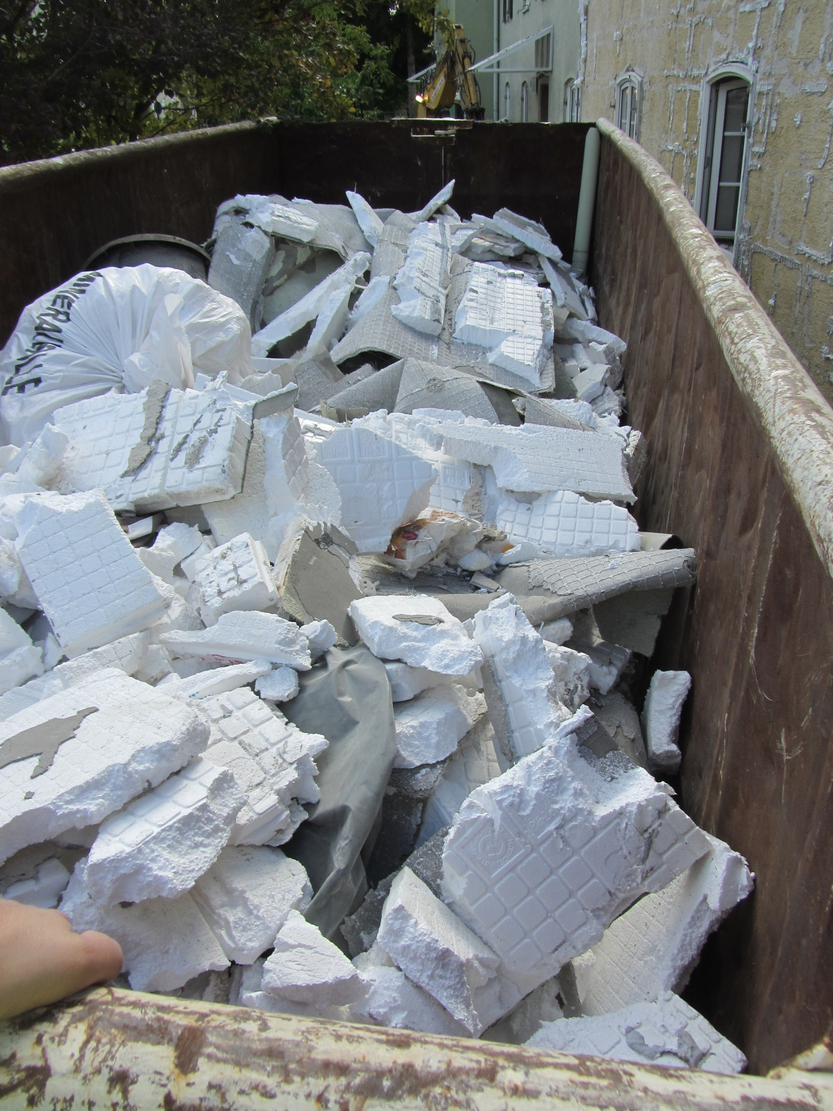 Environmentally responsible insulation disposal in sealed bags