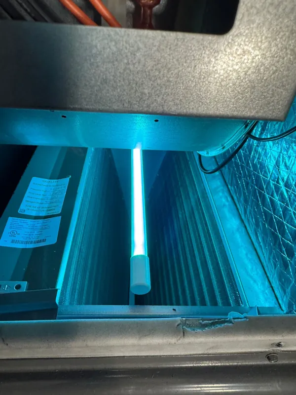 UV light air purifier installed on an AC evaporator coil by Florida Breeze HVAC